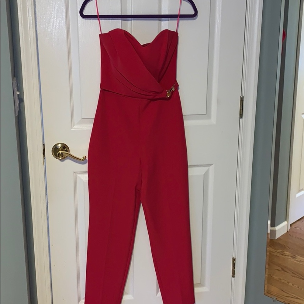 hot pink romper with gold embellishment